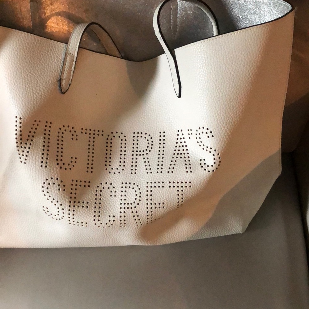 Large white leather VS baggy purse. Silver lining